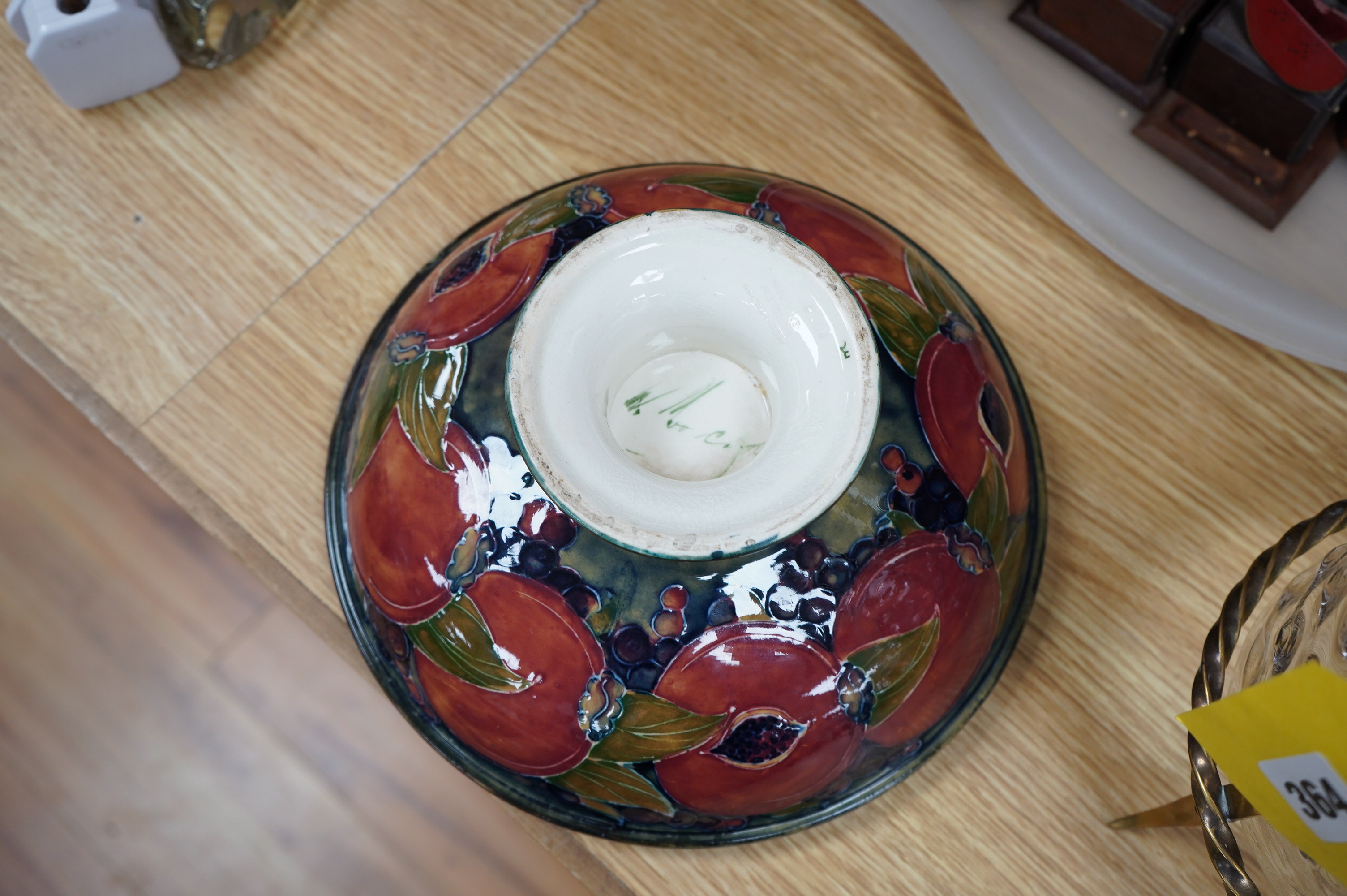 An early Moorcroft pomegranate pattern footed bowl, diameter 23cm.